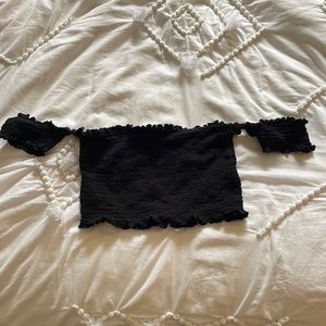 Black off the shoulder ruffled crop top